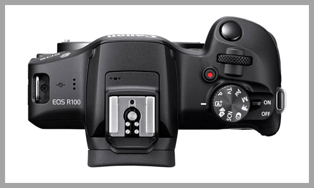 Canon EOS R100 camera showing hot shoe with center contacts