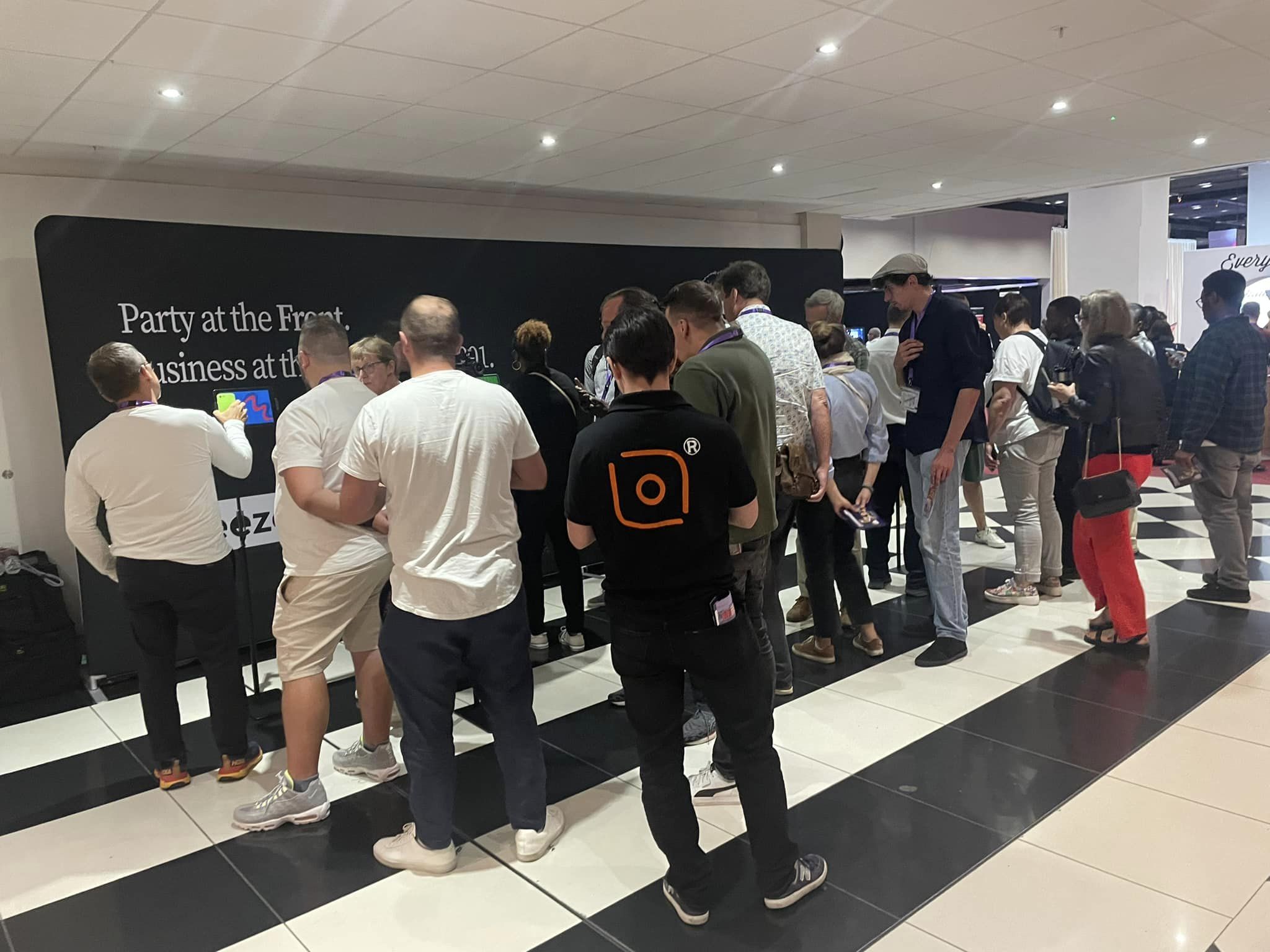 Visitors waiting at the Breeze stand Photo Booth Expo London 2023 tradeshow